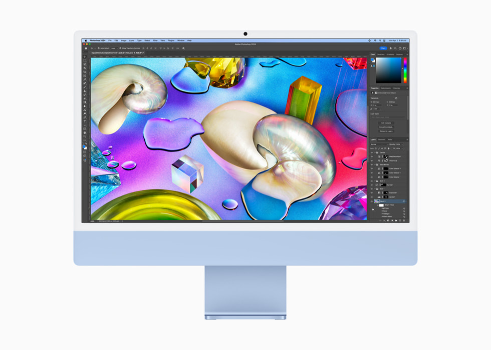 Trên chiếc iMac màu xanh, người dùng đang sử dụng Photoshop.